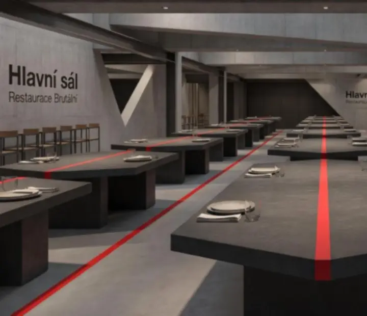 Hlavní sál Bohemiva s masivními stoly, betonem a červenými akcenty pro společenské večery